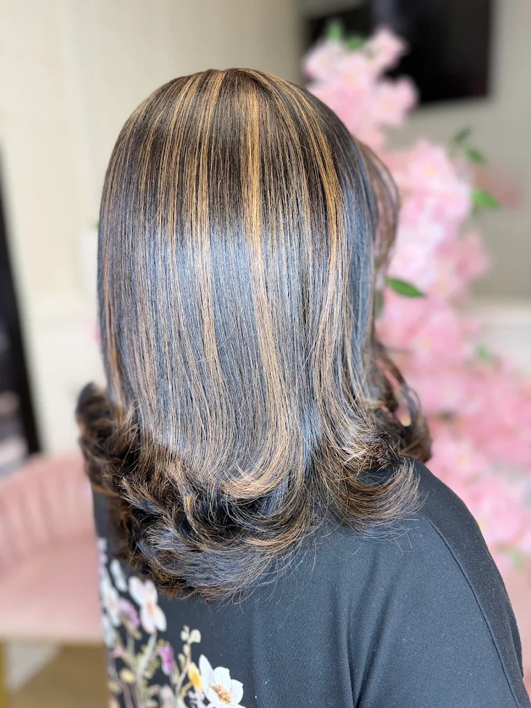 Highlighted silk press with curled ends at Caribbean Queen, Charlotte NC