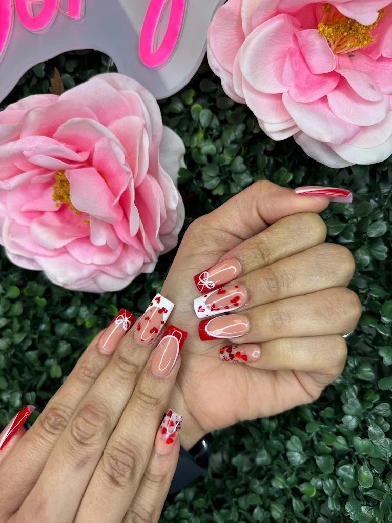 Red heart-themed nail art manicure at Caribbean Queen, Charlotte NC